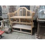 A pair of good quality contemporary three seat garden benches in the Lutyens style