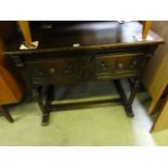 A good quality reproduction oak side/dressing table of rectangular form fitted with two frieze