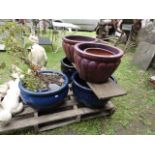 Two pairs of contemporary glazed planters of circular tapered form, one pair with moulded detail