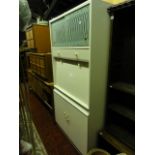 A vintage Remploy freestanding kitchen cabinet enclosed by an arrangement of cupboards and drawers