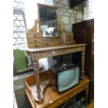 A Victorian pitch pine duchess dressing table, the central rectangular swing mirror raised on shaped