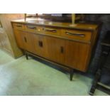 A G plan teak Fresco sideboard enclosed by four doors beneath three drawers with sculptural