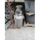 Two aluminium milk churns, one complete with cap and raised relief lettering 'Greenfield Dairies',