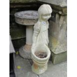 A contemporary cast composition stone garden ornament/planter in the form of a girl in standing pose