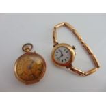 A 14ct gold open-faced pocket watch, the gilt dial centred with floral motifs, black Roman numerals;