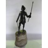 A good quality bronze study of an 18th century mariner clutching a sword in his right hand and