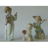 A collection of three Nao figures comprising Poor Teddy, Grand Finale and Petals and Hugs (all