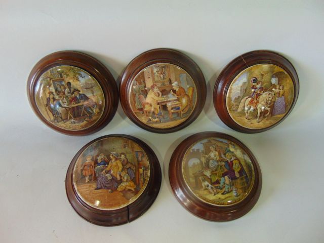 A collection of five 19th century Prattware pot lids including The Battle of the Nile, A pair,