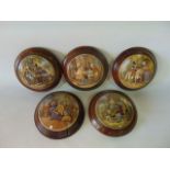 A collection of five 19th century Prattware pot lids including The Battle of the Nile, A pair,