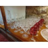 A quantity of glassware including cut glass stemmed drinking glasses, stemmed drinking glasses