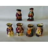 A collection of five Royal Doulton Toby Jugs including Toby XX, The Squire, Jolly Toby, Old