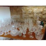 An extensive collection of Edinburgh Crystal and other glassware including suites of drinking