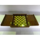 A boxed travelling chess set/folding board