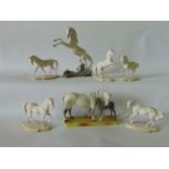 A Beswick group of a grey mare and dark  brown foal, with impressed marks to base 1811, raised on