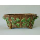 A 19th century Minton two handled majolica game dish base with simulated basket weave, oak leaf