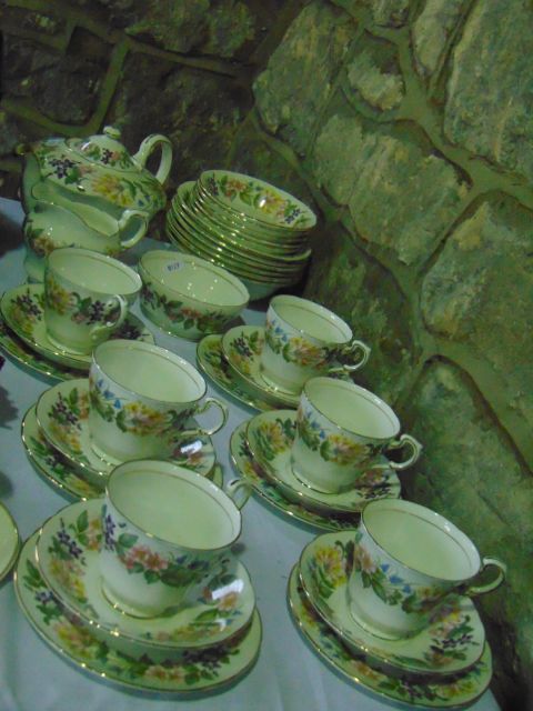 A collection of Paragon China Country Lane pattern tea and dinner wares comprising teapot, milk jug,