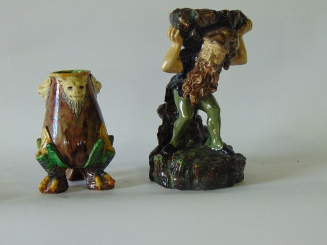 A 19th century continental majolica stand in the form of a bearded dwarf supporting a heavy load and