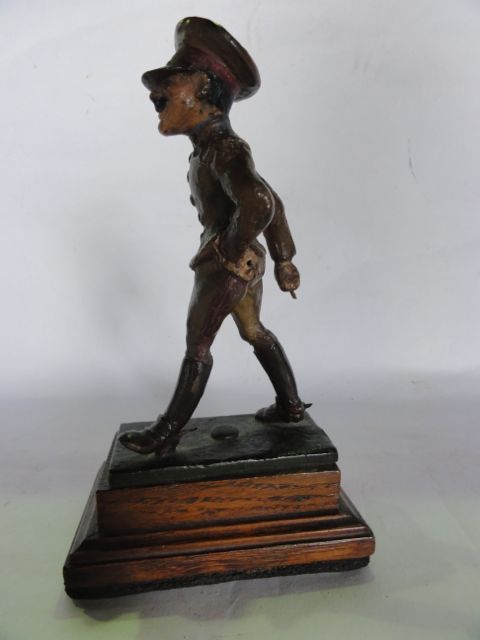 A 20th century cast metal figure of a humorous character in military costume, with painted finish - Image 2 of 2