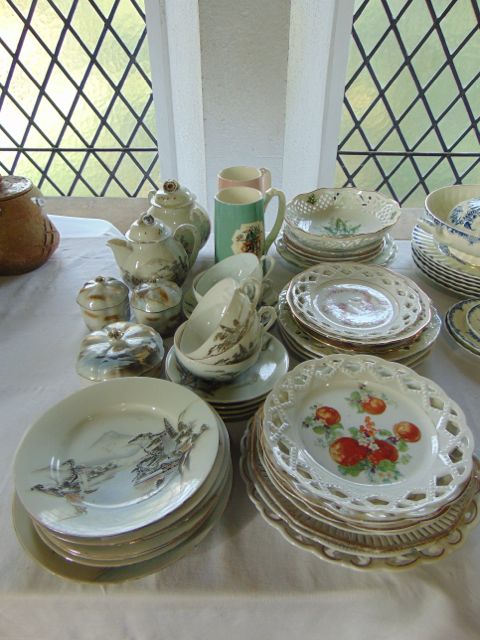 A collection of Japanese eggshell porcelain wares including a circular lidded box and two matching