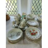 A collection of Japanese eggshell porcelain wares including a circular lidded box and two matching