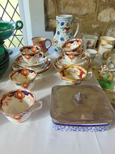 A 19th century continental tin glazed earthenware jug with painted stylised floral decoration in