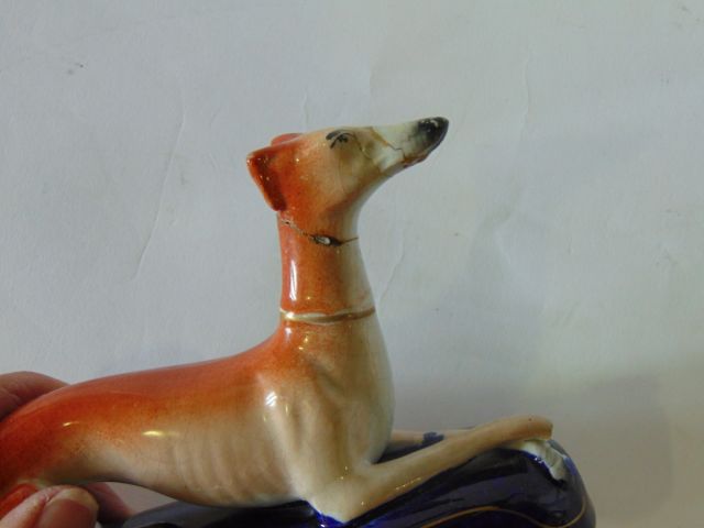 Two 19th century Staffordshire Pottery inkwells in the form of recumbent greyhounds raised on blue - Image 2 of 3
