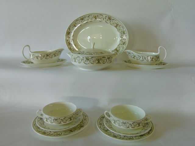 A quantity of Wedgwood Perugia pattern dinner wares with olive green classical border style detail