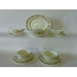 A quantity of Wedgwood Perugia pattern dinner wares with olive green classical border style detail