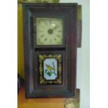 A late 19th century American cased wall clock of squared form, manufactured by Jerome & Company, New