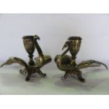 A pair of good quality cast brass chambersticks in the form of mythical birds, with decorative