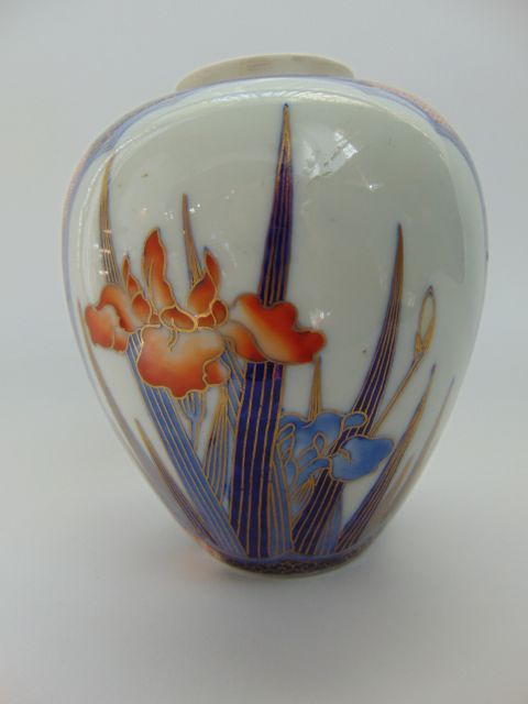 An early 20th century Japanese Fukagawa type vase and cover of ovoid form with painted panels to