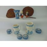 A collection of ceramics including Wedgwood blue ground jasperwares comprising a vase and four