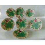 A collection of 19th century dessert wares with relief moulded and painted strawberry and fruiting