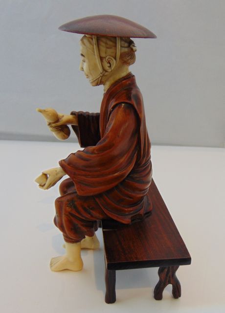 An antique figure of a seated Oriental male, principally in timber, with incised detail to - Image 4 of 6