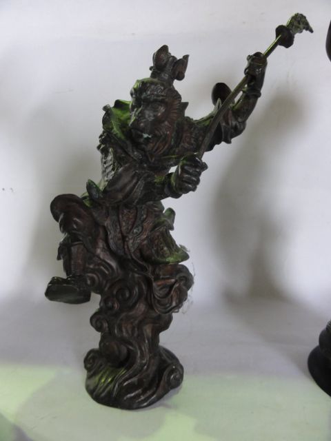 A cast bronze figure depicting a Samurai upon a rearing horse clutching a long handled weapon, 29 cm - Image 2 of 3