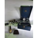 A vintage cased table top gramophone by His Masters Voice together with a polished horn vessel of