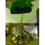 A reproduction desk lamp, principally in brass with an opaque lined green glass shade of rectangular