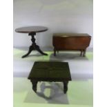 An antique miniature mahogany model of a Georgian occasional table with circular top raised on a