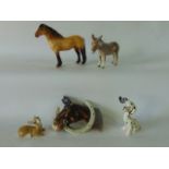 A boxed Beswick model of a donkey, a Beswick wall plaque in the form of a horses head in a horseshoe