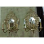 A pair of chromium plated three divisional wall sconces (converted to electricity) with heavily