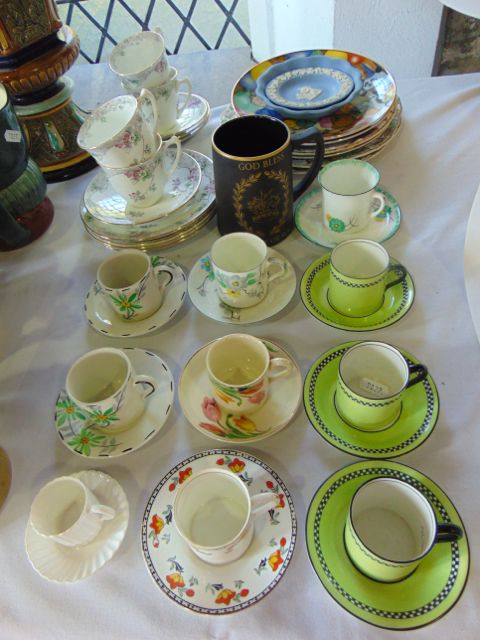 A collection of ceramics including Art Deco coffee cans and saucers with various floral