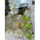 A collection of ceramics including Art Deco coffee cans and saucers with various floral