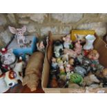 A quantity of ceramic and other models of pigs including NatWest School Girl and Baby money banks, a