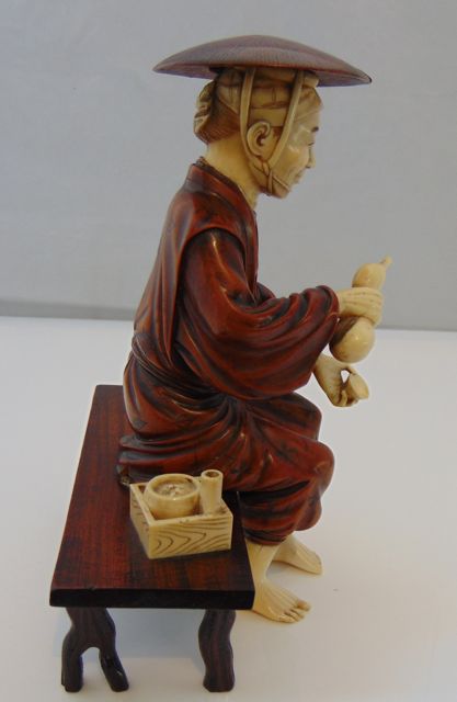 An antique figure of a seated Oriental male, principally in timber, with incised detail to - Image 3 of 6