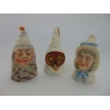 A collection of three Royal Worcester candle snuffers in the form of Mr Caudle, Mrs Caudle and an