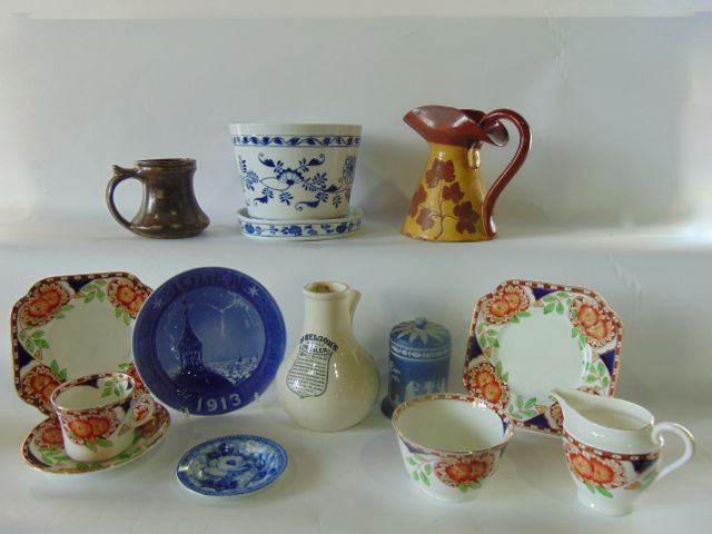 A collection of 19th century and other ceramics including a pair of continental cachepot with blue