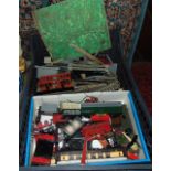 A box containing an assortment of vintage model railway effects to include boxed Hornby 00 gauge