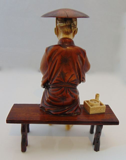An antique figure of a seated Oriental male, principally in timber, with incised detail to - Image 2 of 6