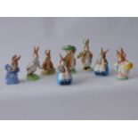 A collection of seven Royal Albert Beatrix Potter figures of rabbits including Cotton Tail, Benjamin