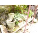A quantity of weathered composition stone garden planters of varying size and design (some planted)